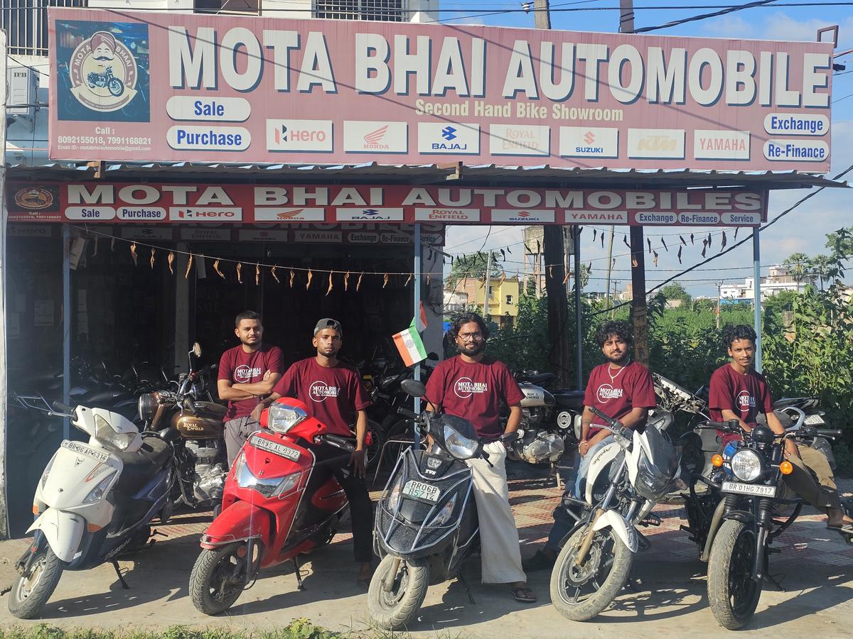 Mota Bhai Automobiles shop front with staff